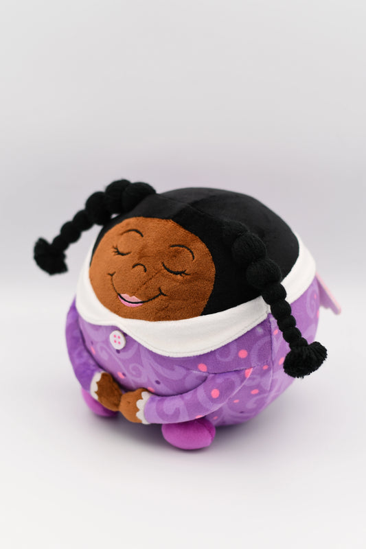 Plush toy of a child in a purple outfit with a white collar on a light gray background