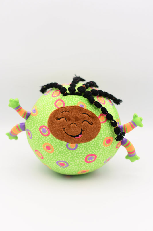 Toy figure of a virus with a smiling face and colorful braids on a white background