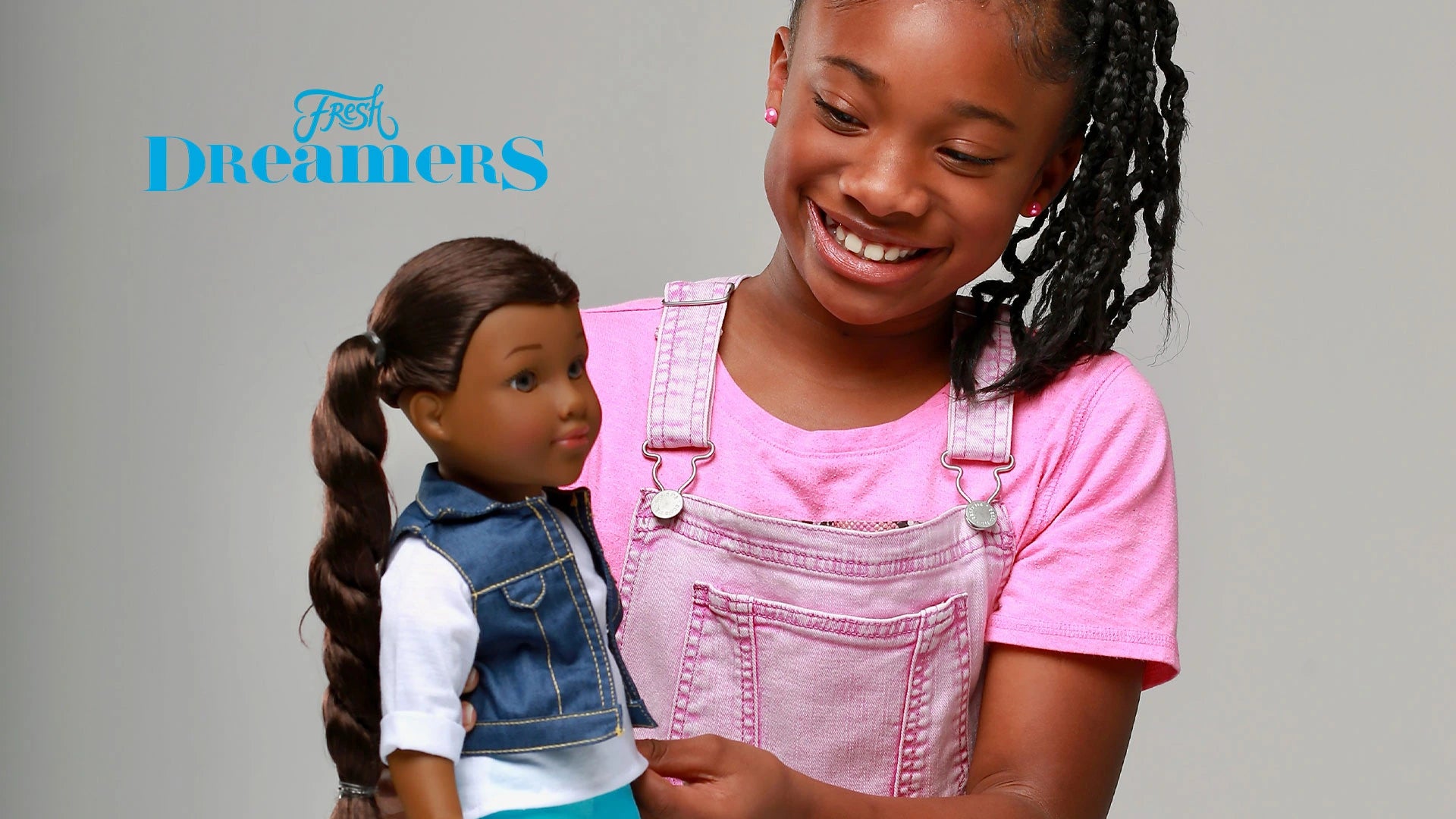 Black girl kid holding the fresh dreamers doll