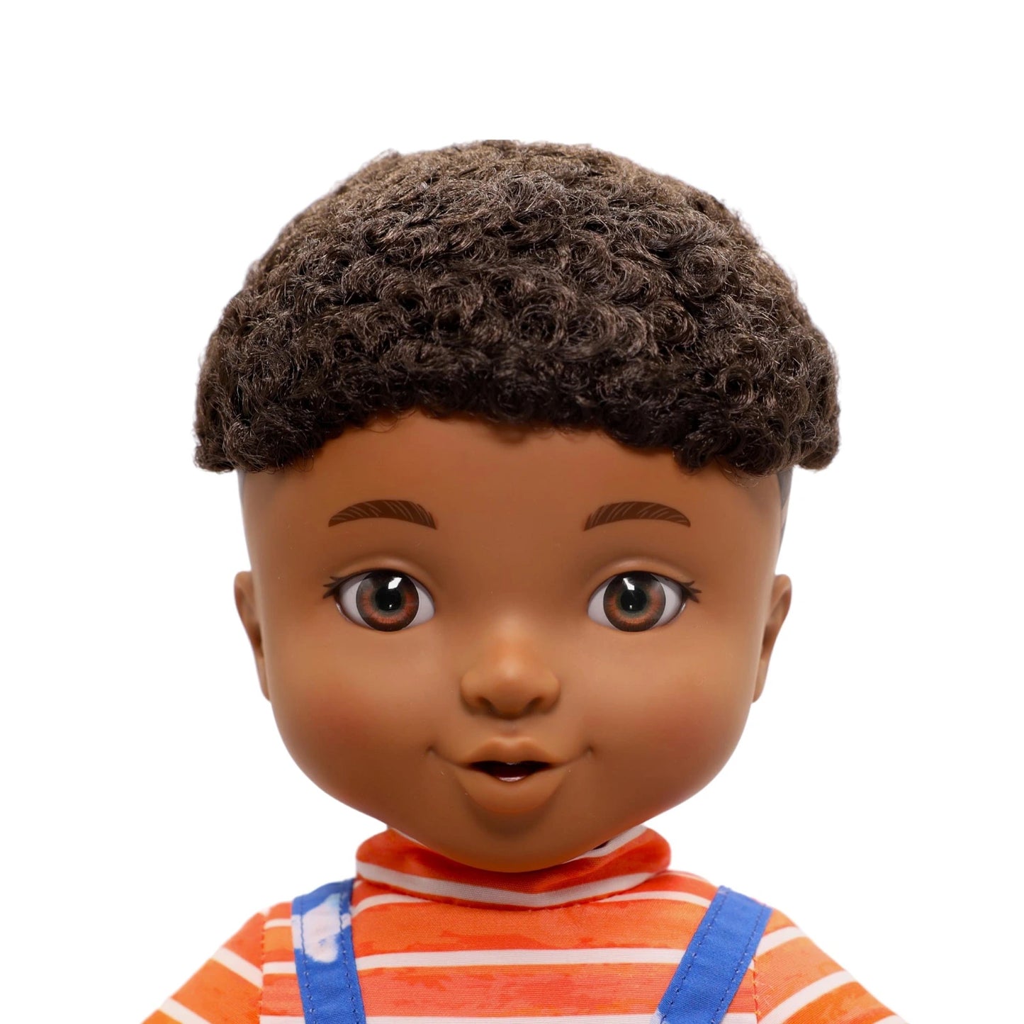 Close-up of a doll with brown hair and striped shirt on a white background
