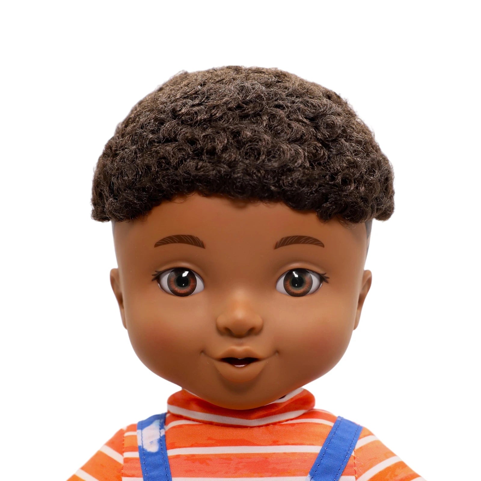 Close-up of a doll with brown hair and striped shirt on a white background