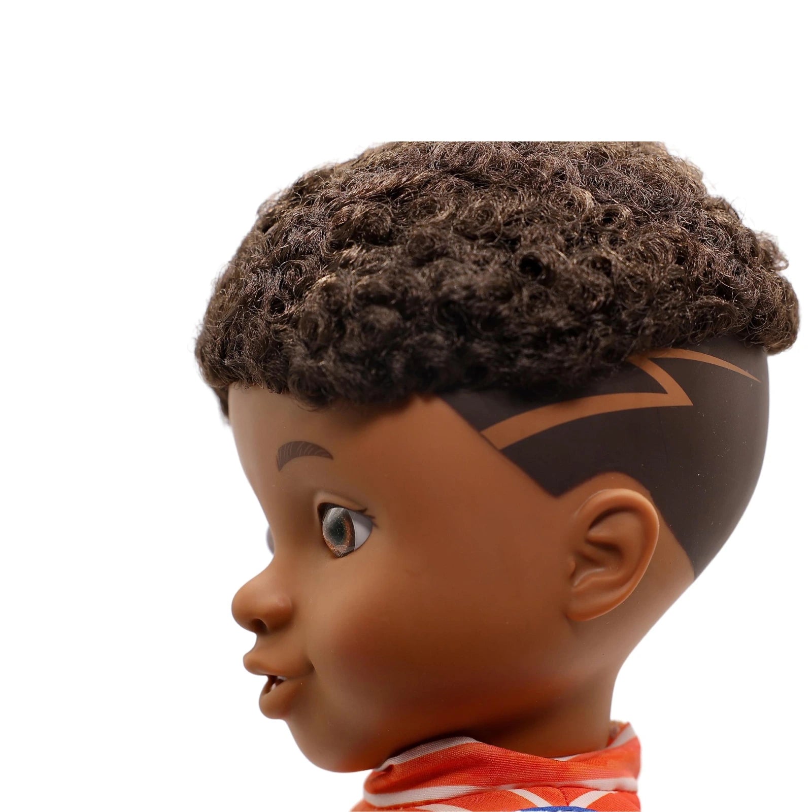 Close-up of a doll head with detailed hair and facial features on a white background