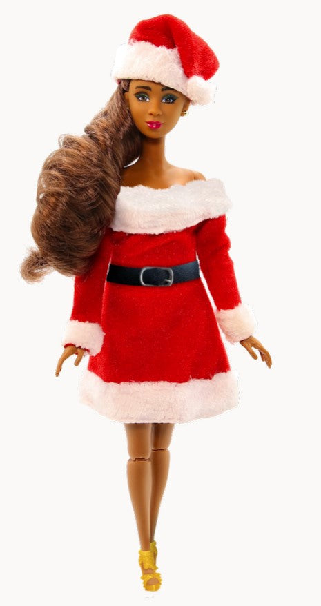 Barbie doll in a Santa outfit with a white background