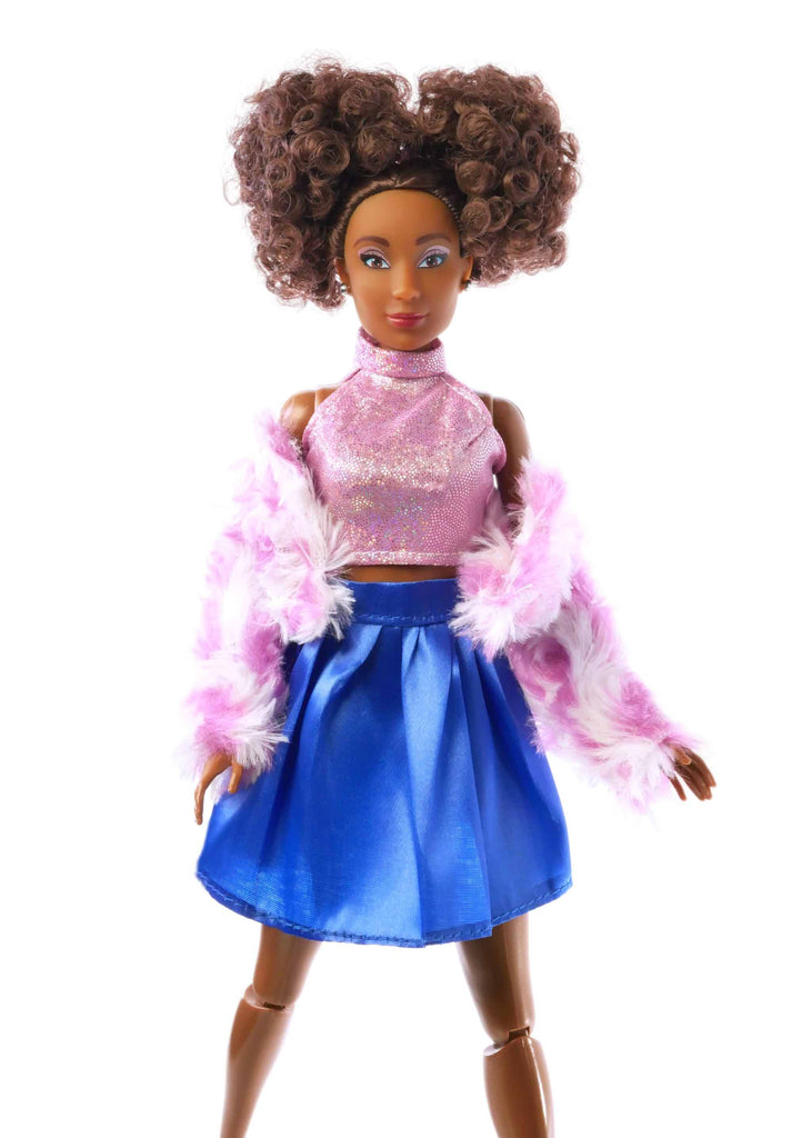 fashion doll brown curly hair with pink top, pink scarf, and blue skirt,