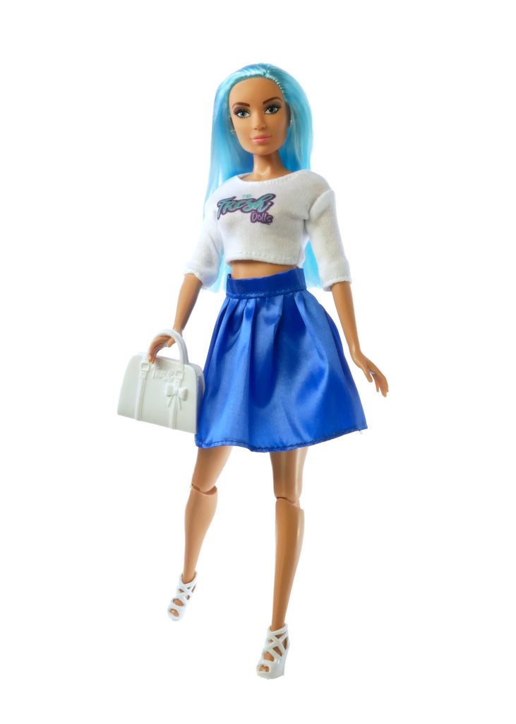 blue haired fashion doll wearing white top with sleeves and blue skirt holding white purse